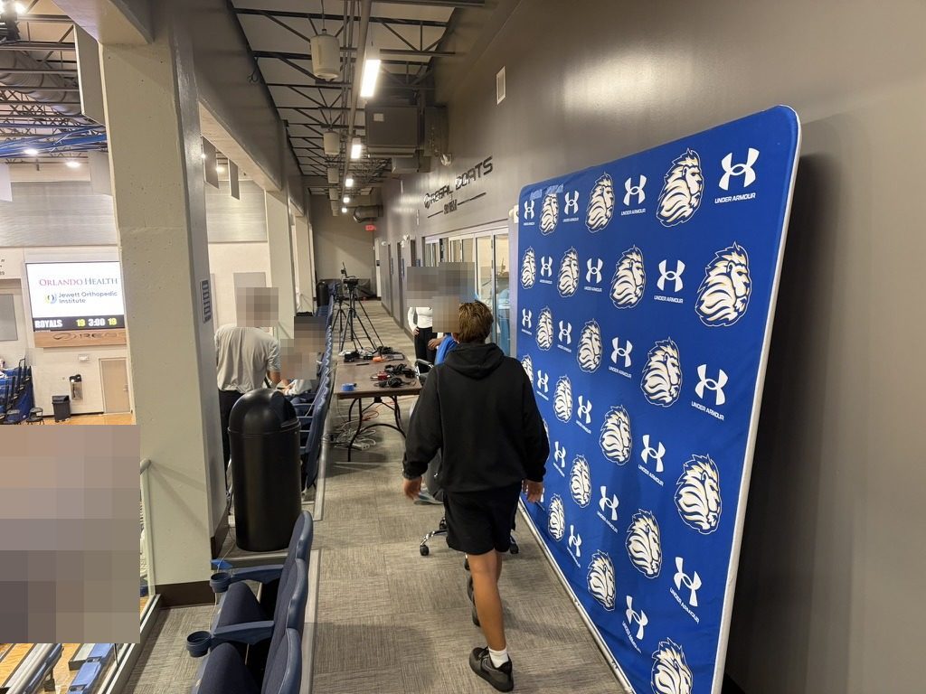Student crew setting up a high school basketball broadcast